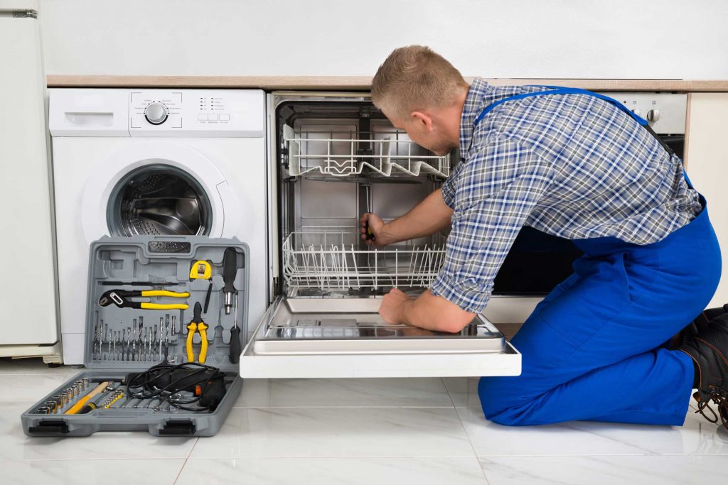 technician fixing a dishwasher repair scranton