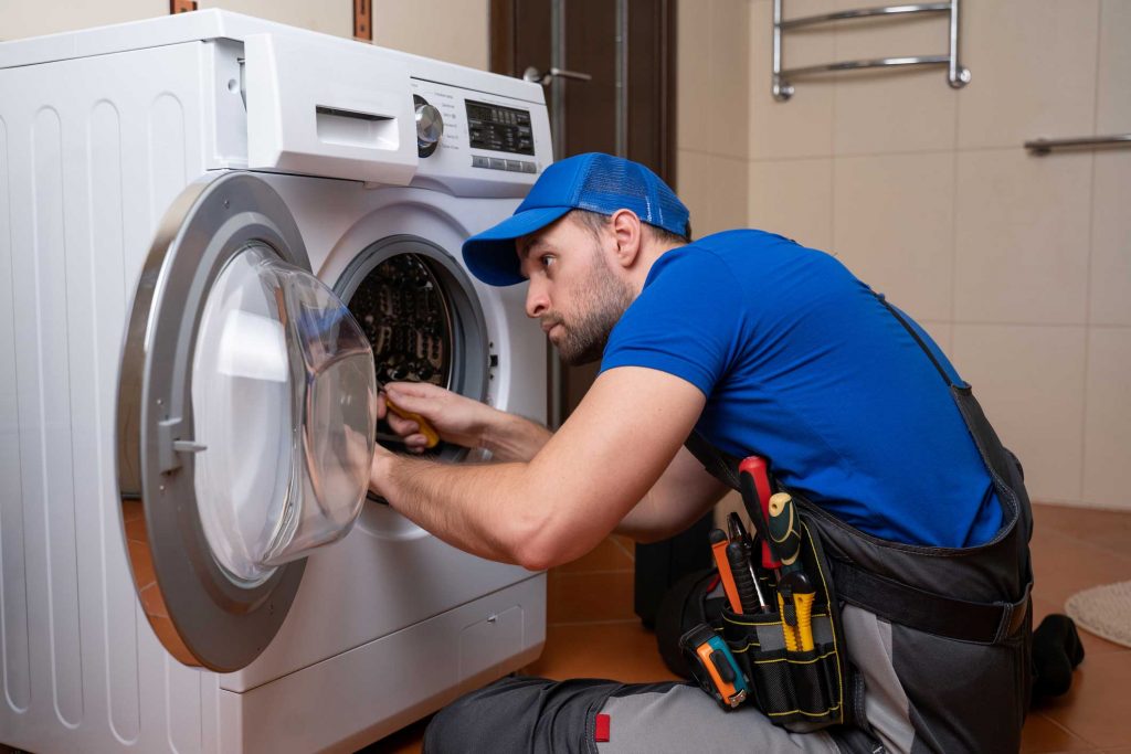 a technician repairing a washer and dryer repair scranton