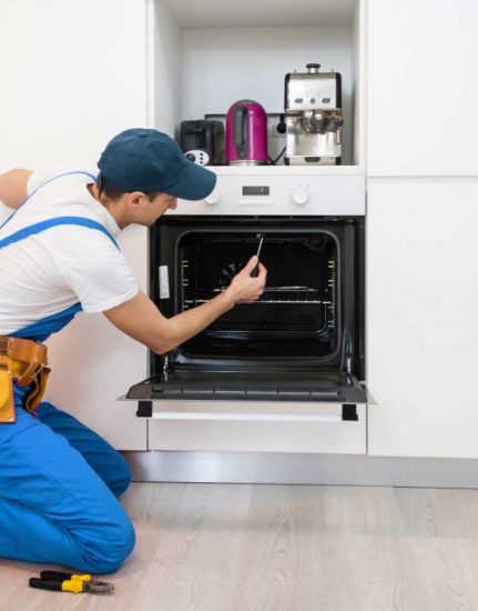 man repairing oven - About Scranton Appliance Repair Pros - Oven Repair Scranton