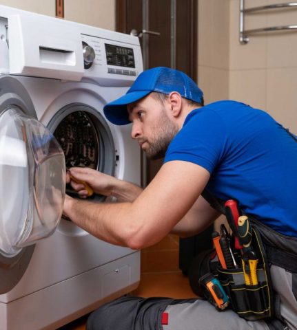 a technician repairing a washer and dryer repair scranton